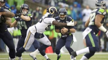 Dec 27, 2015; Seattle, WA, USA; St. Louis Rams defensive end William Hayes (95) sacks Seattle Seahawks quarterback Russell Wilson (3) during the second quarter at CenturyLink Field. Mandatory Credit: Troy Wayrynen-USA TODAY Sports