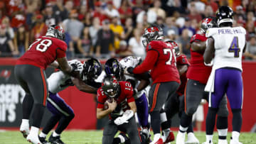 TAMPA, FLORIDA - OCTOBER 27: Justin Houston #50 of the Baltimore Ravens sacks Tom Brady #12 of the Tampa Bay Buccaneers during the second quarter at Raymond James Stadium on October 27, 2022 in Tampa, Florida. (Photo by Douglas P. DeFelice/Getty Images)