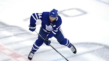 Morgan Rielly #44 of the Toronto Maple Leafs passes the puck. (Photo by Andre Ringuette/Freestyle Photo/Getty Images)