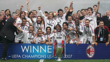 AC Milan's team poses with the trophy  a...