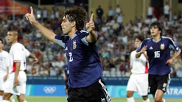 Argentina's Cesar Delgado celebrates (C)