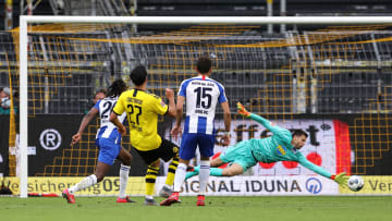 Emre Can gives Borussia Dortmund the lead against Hertha BSC.