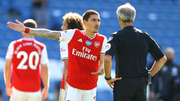 Hector Bellerin protests with referee Martin Atkinson