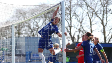 Sam Kerr hangs from the crossbar, because why not? 