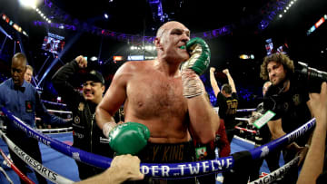 Tyson Fury celebrates after beating Deontay Wilder for the heavyweight title