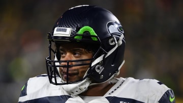 Russell Wilson looking towards the sidelines in last year's Divisional Round game vs. the Packers 