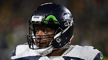 Russell Wilson looking towards the sidelines in last year's Divisional Round game vs. the Packers 