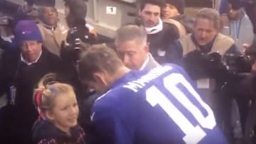 Eli Manning with his daughter after his final home start at MetLife Stadium.