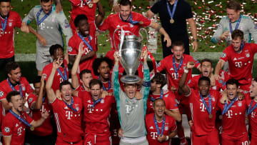 Manuel Neuer hoists aloft the Champions League trophy after an imperious individual display in the final 