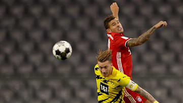 Klarer Sieger: Lucas Hernandez gewinnt das Kopfballduell gegen Marco Reus