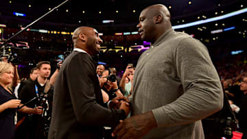 Shaquille O'Neal and Kobe Bryant at a Lakers game.