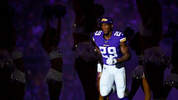 Vikings cornerback Xavier Rhodes jogs out of the tunnel as he's announced in the starting lineup against the Packers.