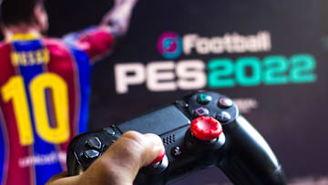 PES 2022 com novidades | In this photo illustration, a PlayStation (PS) controller...
