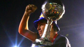 Juan Roman Riquelme of Boca Juniors hold...