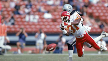 Chiefs defensive back Kevin Ross dives to break up a pass during a game against the Raiders.