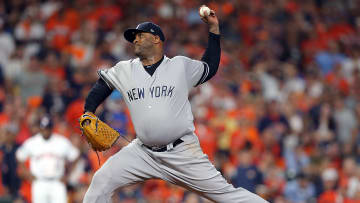 CC Sabathia winds up a pitch for the New York Yankees in playoff game.