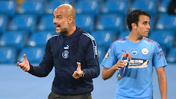 Pep Guardiola dan Eric Garcia