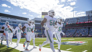 Miami Dolphins defense running out on the field for warmups against the Buffalo Bills