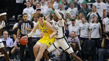Michigan's Jon Teske backs down Michigan State's Marcus Bingham Jr. on Jan. 5.