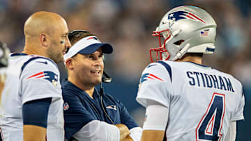 New England Patriots quarterbacks Brian Hoyer and Jarrett Stidham with offensive coordinator Josh McDaniels