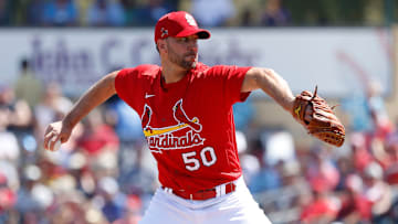 Cardinals pitcher Adam Wainwright delivers a pitch from the stretch during a Spring Training game against the Mets.