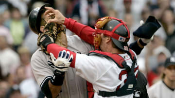 Red Sox catcher Jason Varitek, right, shoves his glove in the face of Yankees third baseman Alex Rodriguez in 2004.