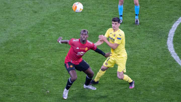 Paul Pogba of Manchester United and Gerard Moreno of...