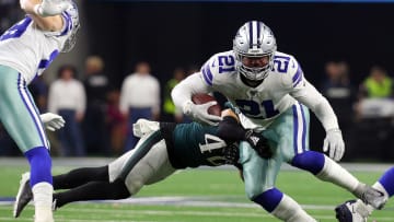 Dallas Cowboys running back Ezekiel Elliot escapes pressure from the Philadelphia Eagles' defense.