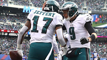 Eagles quarterback Nick Foles, right, meets with receiver Alshon Jeffery in the end zone after a touchdown against the Giants.