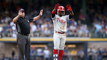 Herrera salutes to the Phillie bench after a double against the Brewers