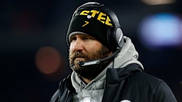 Steelers quarterback Ben Roethlisberger watches from the sideline with a headset during a game against the Browns.
