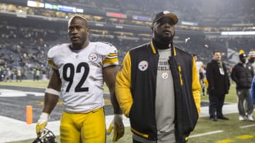 Pittsburgh Steelers head coach Mike Tomlin and former linebacker James Harrison