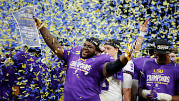 The LSU Tigers celebrate their SEC Championship win over the Georgia Bulldogs.