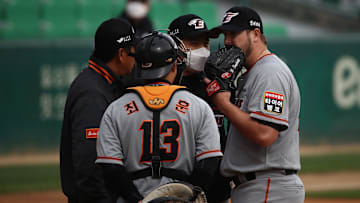A meeting at the mound for the Hanwha Eagles in a game vs. the SK Wyverns in the KBO