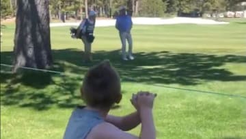 John Smoltz throws pretend pitch to young fan at American Century Championship.