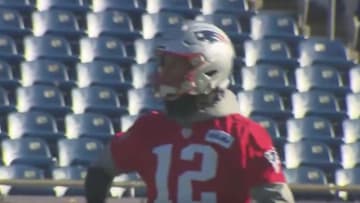 Tom Brady was spotted shaking his harm after throwing a pass at the Patriots' practice on Friday. 