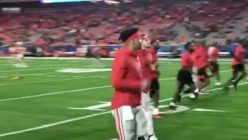 Ohio State QB Justin Fields wears large knee brace warming up vs Clemson