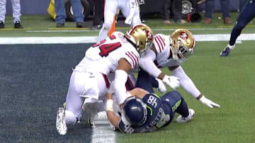 The 49ers won the NFC West after stopping the Seahawks just inches short of the goal line.
