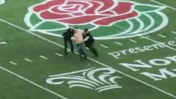 This adventurous fan was taken away after running on the field