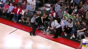 NBA referee Mitchell Ervin bumps into woman with drink tray