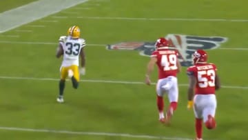 Aaron Jones puts on the jets on 67-yard touchdown on screen pass against Chiefs on Sunday.