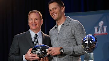Roger Goodell presents Super Bowl LI MVP Tom Brady with the Pete Rozelle Trophy.
