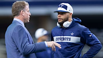Cowboys legend Troy Aikman conversing with Dallas quarterback Dak Prescott