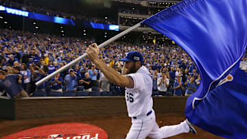 Greg Holland bringing the Kansas City Royals' flag to the people.