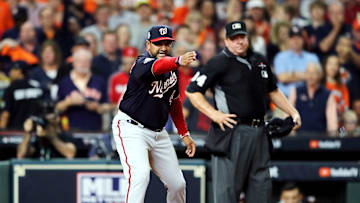 Washington manager Dave Martinez disputes a call with an umpire in Game 6 of the World Series