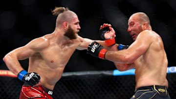 SINGAPORE, SINGAPORE - JUNE 12: Glover Teixeira of Brazil exchanges strikes with Jiri Prochazka of Czech Republic during their light Heavyweight Championship Fight at Singapore Indoor Stadium on June 12, 2022 in Singapore. (Photo by Yong Teck Lim/Getty Images)