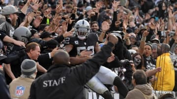 Nov 27, 2016; Oakland, CA, USA; Oakland Raiders defensive end Khalil Mack (52) celebrates after scoring a touchdown on an interception against the Carolina Panthers during the first half at Oakland-Alameda County Coliseum. Mandatory Credit: Kirby Lee-USA TODAY Sports