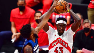 TAMPA, FLORIDA - FEBRUARY 14: Pascal Siakam #43 of the Toronto Raptors looks to pass the ball against Jaylen Nowell #4 of the Minnesota Timberwolves (Photo by Julio Aguilar/Getty Images)