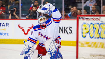 Jan 2, 2020; Calgary, Alberta, CAN; New York Rangers goaltender Henrik Lundqvist (30) makes a save against the Calgary Flames during the first period at Scotiabank Saddledome. Mandatory Credit: Sergei Belski-USA TODAY Sports