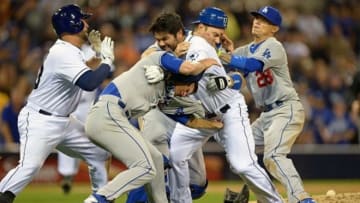 Apr 11, 2013; San Diego, CA, USA; San Diego Padres left fielder Carlos Quentin (middle right) and Los Angeles Dodgers starting pitcher Zack Greinke (middle left) tangle as Dodgers catcher A.J. Ellis (17) and shortstop Justin Sellers (28) and Padres first baseman Yonder Alonso (left) join in the bench clearing fight during the sixth inning after Quentin was hit by a pitch at PETCO Park. Mandatory Credit: Jake Roth-USA TODAY Sports